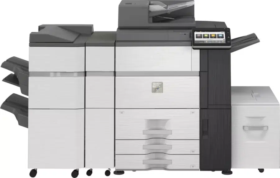 A large, white and gray Sharp multifunction printer with multiple paper trays and a touchscreen display sits on casters.
