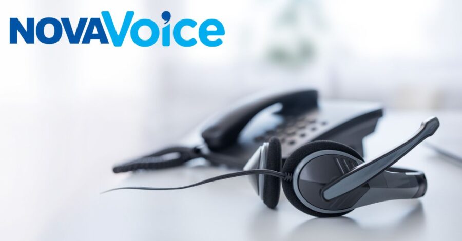 A headset and telephone are placed on a desk, with the 