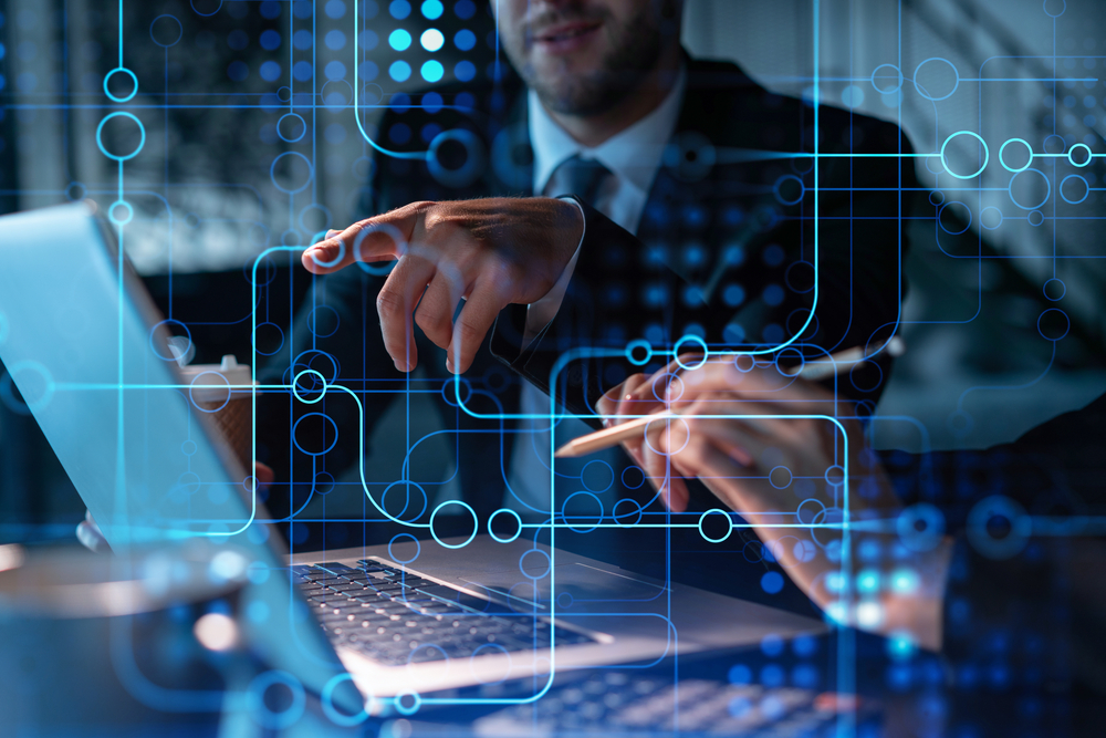 Two professionals collaborate on a